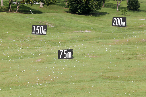 Focus scene on drive range at golf course