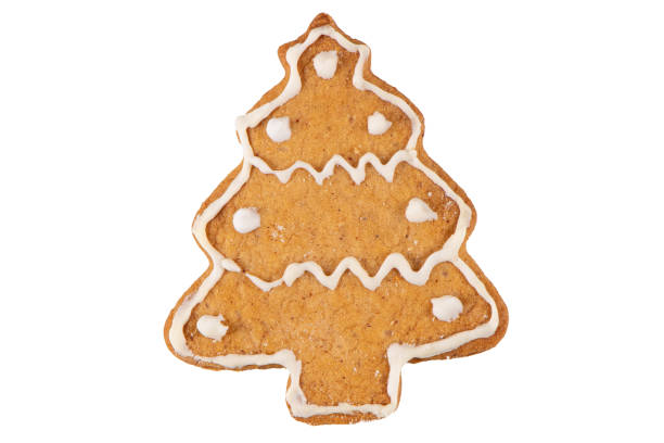 istock Christmas tree shaped cookie decorated with royal icing, isolated on white background. Christmas food, pastry background. New Year theme 1800292305