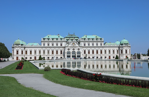 Vienna, WIEN, Austria - August 22, 2023: Belvedere Castle and little lake and flowers