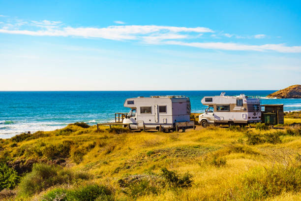istock Camper rv camping on sea shore, Spain 1800319349