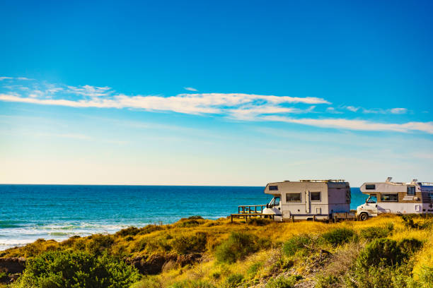 istock Camper rv camping on sea shore, Spain 1800320400