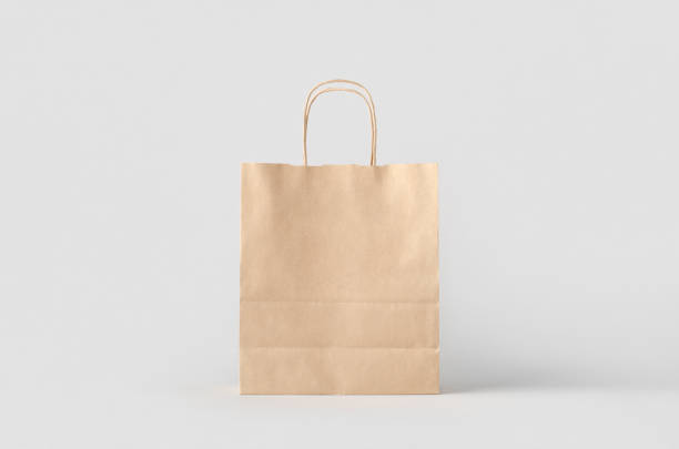 istock Kraft paper bag with handles, blank mockup isolated on a grey background. 1800326618