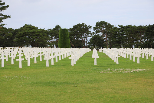Colleville-sur-Mer, FRA, France - August 21, 2022: American Military Cemetery and white crosses on the graves of the soldiers