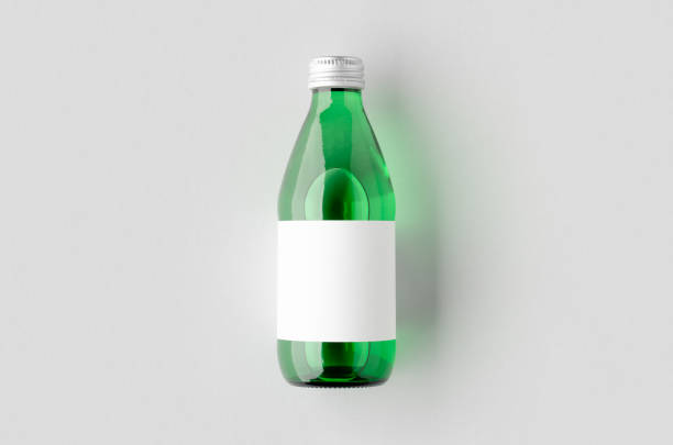 istock Water bottle mockup with a blank label. Green glass. 1800327309