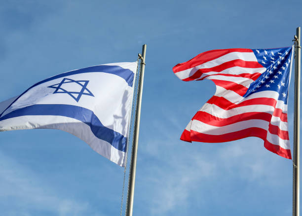 istock two large Israeli and American flags flying in the sky 1800332049