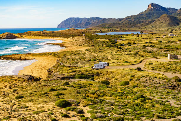 istock Coast view with camper rv camping on sea shore, Spain 1800336277