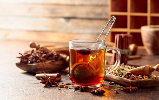 Christmas herbal tea with cinnamon, anise, and dried herbs. stock photo