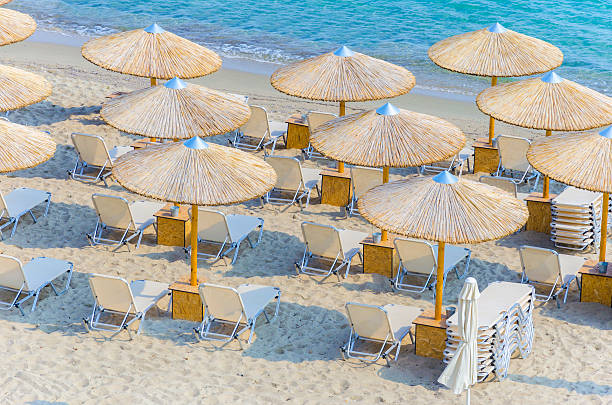 istock Sun loungers with an umbrella on the beach 180035863