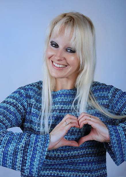 istock Woman making heart shape with her hands 180037085
