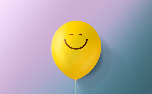 Happiness Day Concept. Happy and Optimistic Mind, Well Mental Health. Enjoying Life Everyday. a Smiling Emoticon Balloon against a colorful Wall