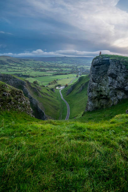 istock Stunning dramatic early Autumn dawn landscape image viewed along Winnats Pass in Peak District England 1800390507