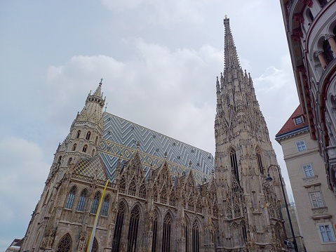 Vienna, Austria - June 8, 2023: Facade view of St. Stephen's Cathedral in Stephansplatz square. The mother church of the Roman Catholic Archdiocese of Vienna city, Austria.