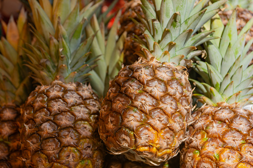 fresh pineapple at a fruit market in the summer