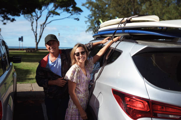 istock Mature adult siblings preparing for surf session 1800407768