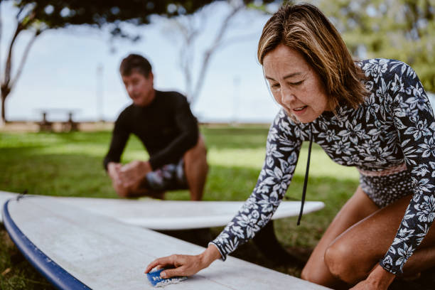 istock Active multiracial senior woman going surfing with her brother 1800407787