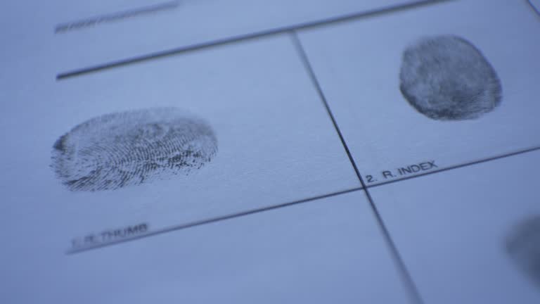 Criminal at the Police station giving finger prints as a suspect of a murder