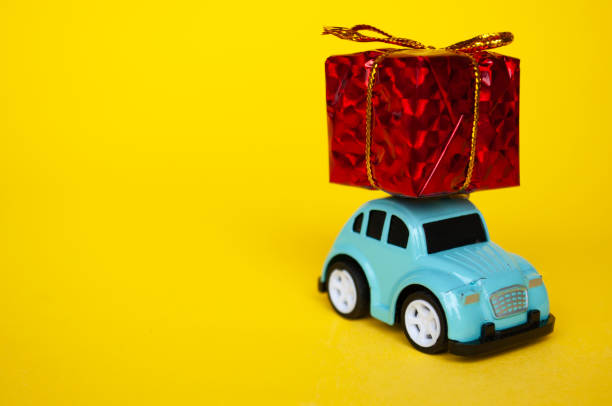 istock Toy car carrying present in red with customizable space for text 1800438538