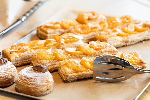 A selection of breakgast pastries on a serving tray.