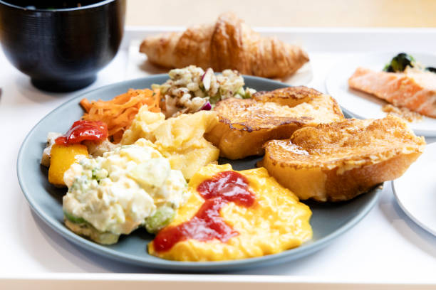 Japanese Breakfast Spread A Nutritious Breakfast with a Mix of Western and Asian Dishes on a Plate french toast bacon bread butter stock pictures, royalty-free photos & images