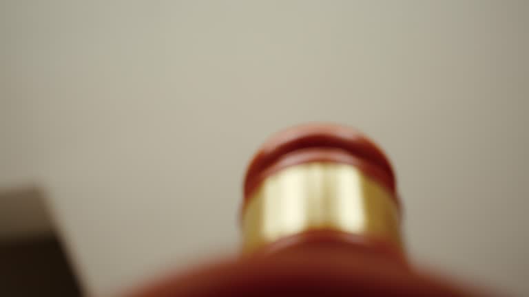 Judge reads the sentence to be afflicted on the criminal in the courtroom