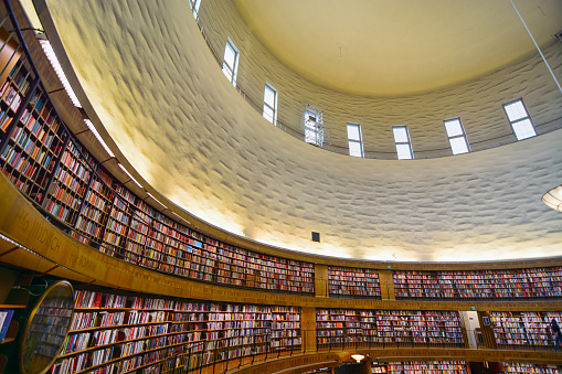 The sun shines on the upper floor of the library