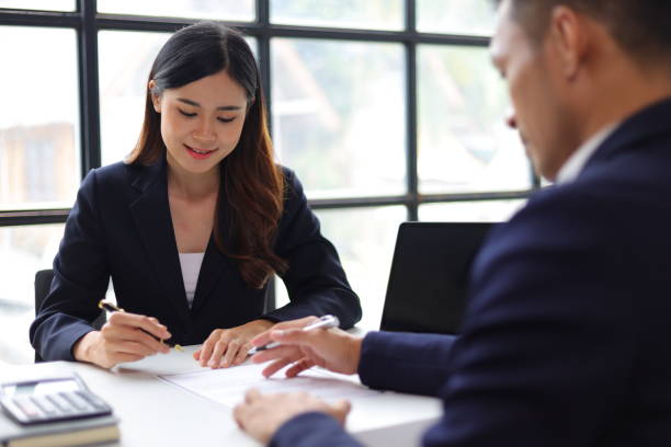 istock Manager reading resume while interviewing new employee candidates in office, job interview. 1800445048