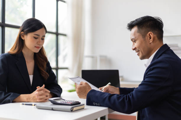 istock Manager reading resume while interviewing new employee candidates in office, job interview. 1800445059