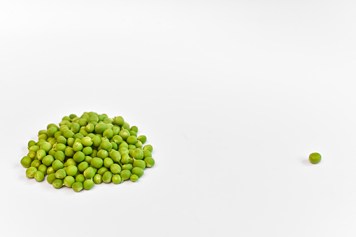 heap fresh green peas on a white background