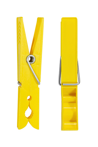 Yellow clothespin on a blank background.