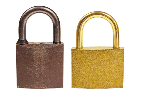 Brown old and gold padlock on empty background