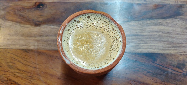 Traditional Kulhad Chai is a tea beverage made by boiling black tea in milk and water with a mixture of aromatic herbs and spices.