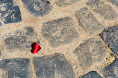 Cobblestones and red heart on a summer day