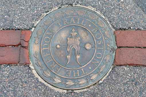 This is the embossed plaques on the freedom trail that indicate a place of interest.