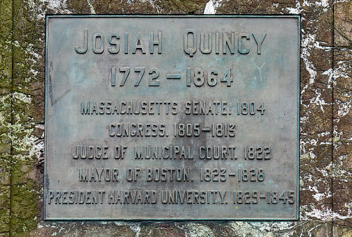 Josiah Quincy plaque on the wall in Granary Burying Ground in Boston.