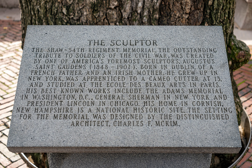 The text below the memorial to Robert Gould Shaw by Augustus Saint-Gaudens opposite the State Capitol Building on Boston Common). Robert Gould Shaw is seen leading members of the 54th Regiment Massachusetts Volunteer Infantry 1863. The sculpture was unveiled on May 31, 1897. the first civic monument to pay homage to the heroism of African American soldiers.