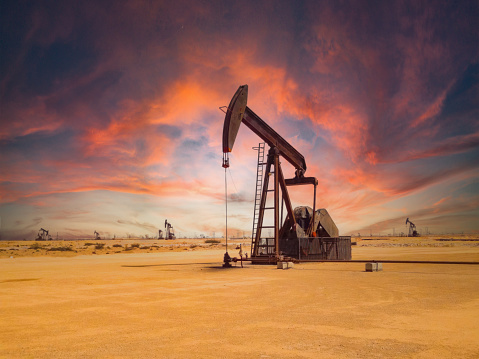 An oil pump jack in the desert of Oman