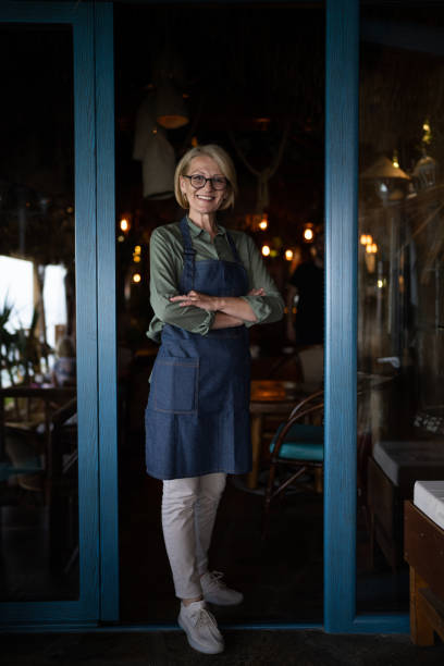 istock Mature female waitress 1800567580