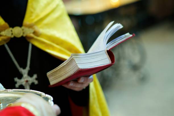 istock The Christian priest holding a Bible 1800576048