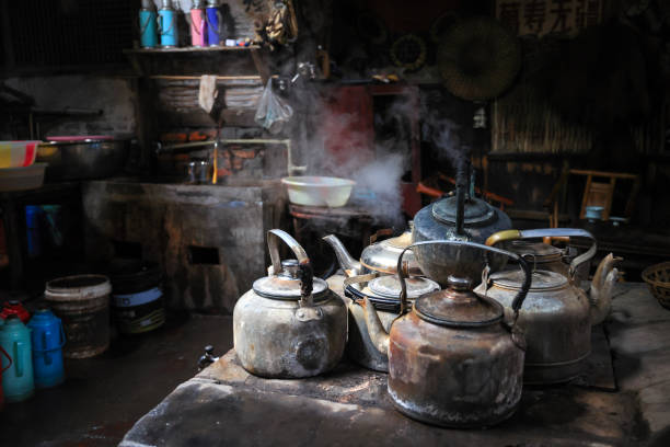 istock Tea kettles on the coal stove with side lighting 1800577625