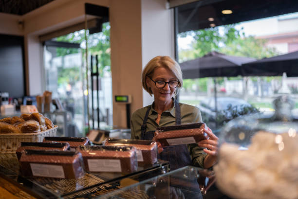 istock Mature woman working in bakery 1800579218