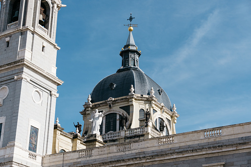 Almudena Cathedral in Madrid. Exterior view of dome and facade. It is a Catholic church in Madrid, Spain, and the seat of the Roman Catholic Archdiocese of Madrid. Telephoto lens