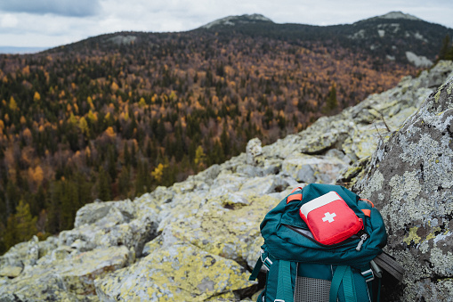 A first aid kit, a red medicine bag, a hiking set of medicines, a first aid kit. High quality photo
