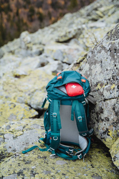 istock A small first aid kit is in the backpack, traveling through the mountains with a backpack, trekking on the rocks, tourist equipment on a hike. 1800611583