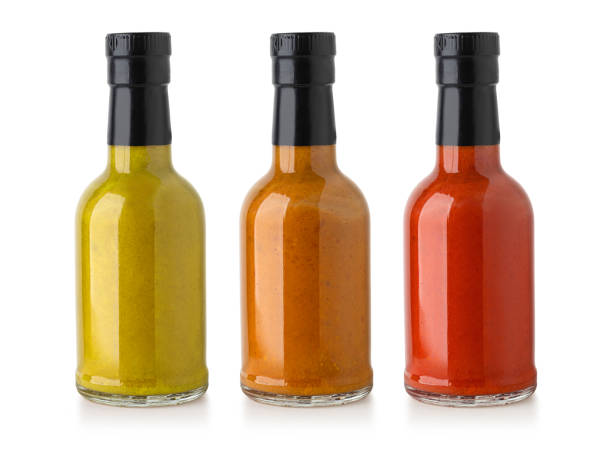 bbq sauce bottle barbecue sauces in glass bottles with clipping path condiment stock pictures, royalty-free photos & images