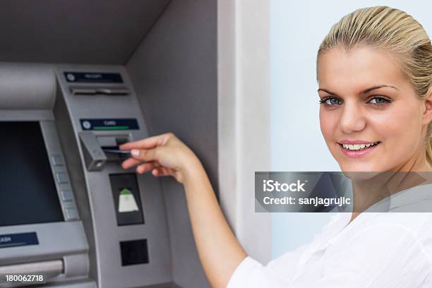 Beautiful Businesswoman Withdrawing Money From Credit Card At Atm Stock Photo - Download Image Now