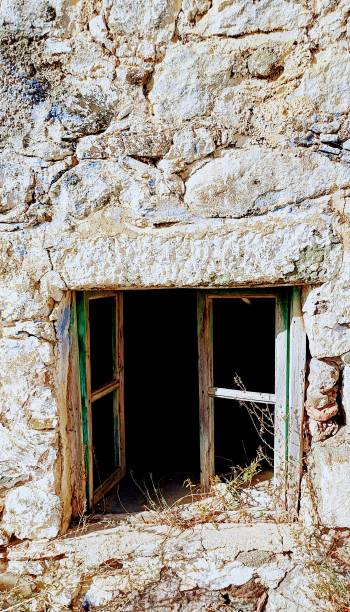 istock Old stone house, ruin, wooden shutter 1800636152