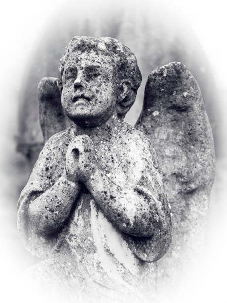 Sideview of an Angel statue in a graveyard