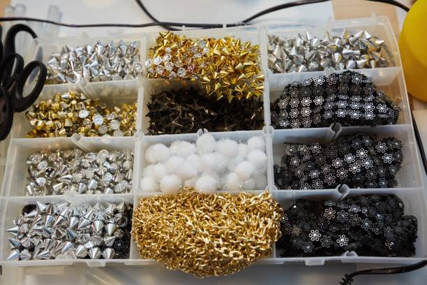 istock Various materials for needlework. A set of rivets, chains and other creative items. 1800669505