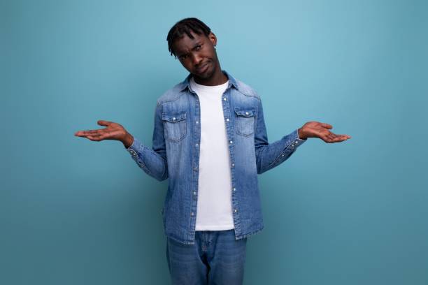 istock frustrated feelings african man with dreadlocks in denim jacket 1800716087