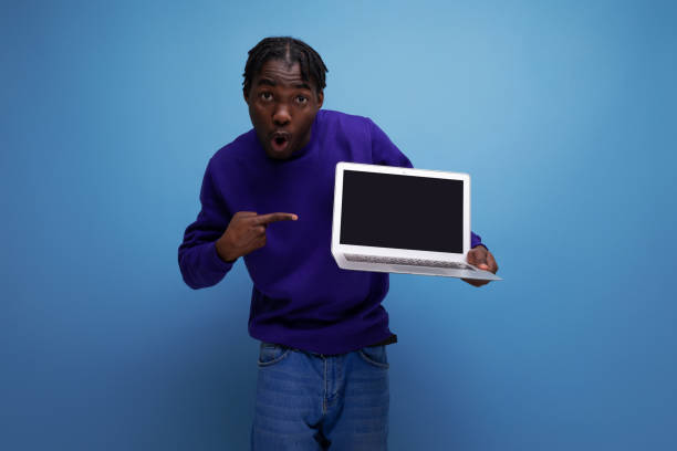 istock office specialist african young brunette man with dreadlocks with laptop 1800716615